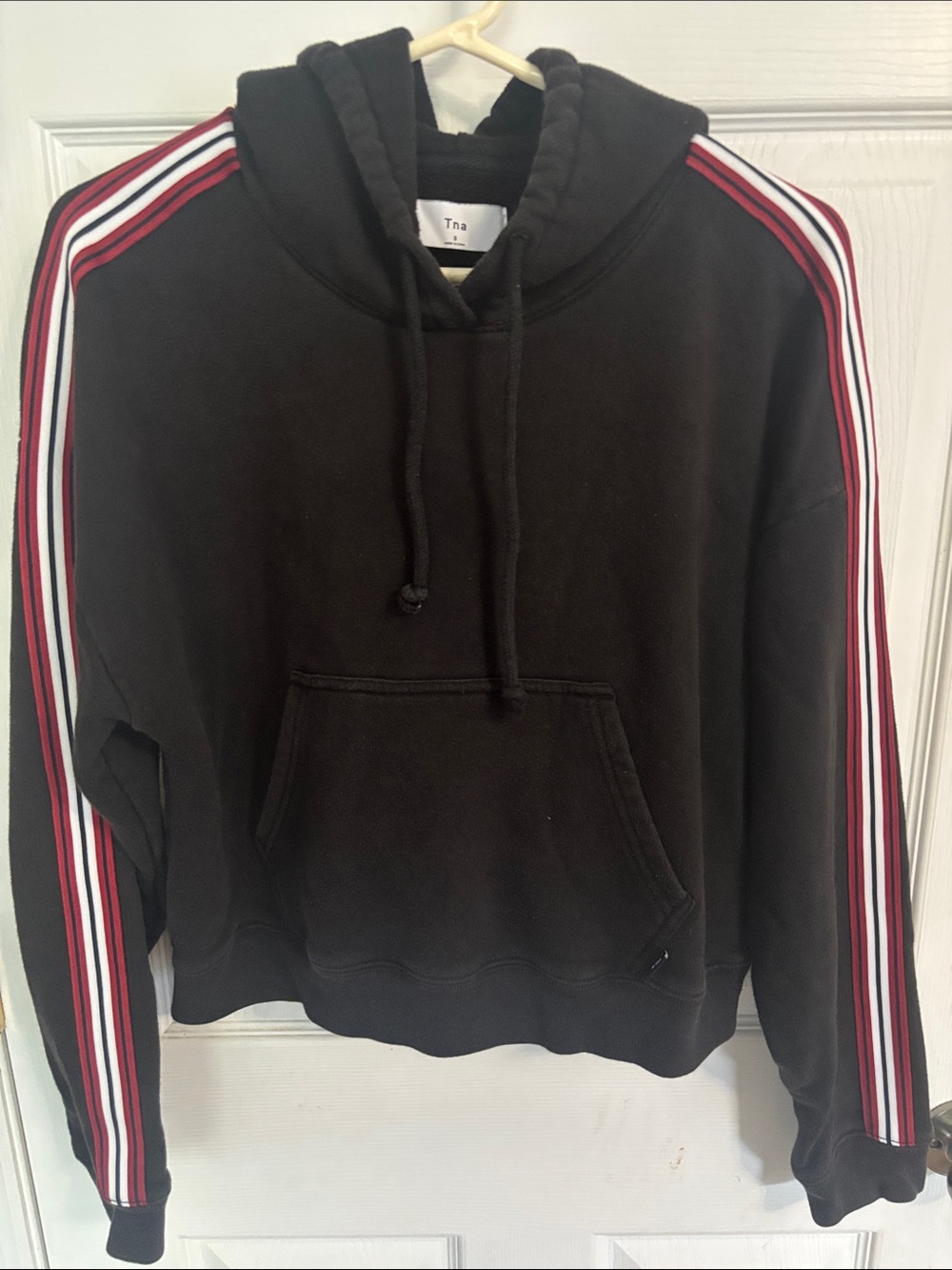TNA Black Pullover Hoodie with Red and White Sleeve Stripes